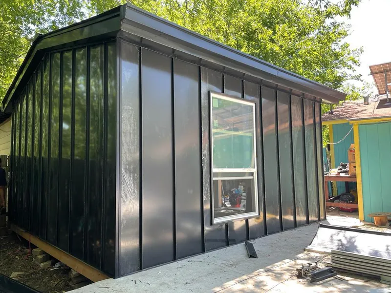 Black standing seam metal wall panels for Roof Inspection in Mounds View