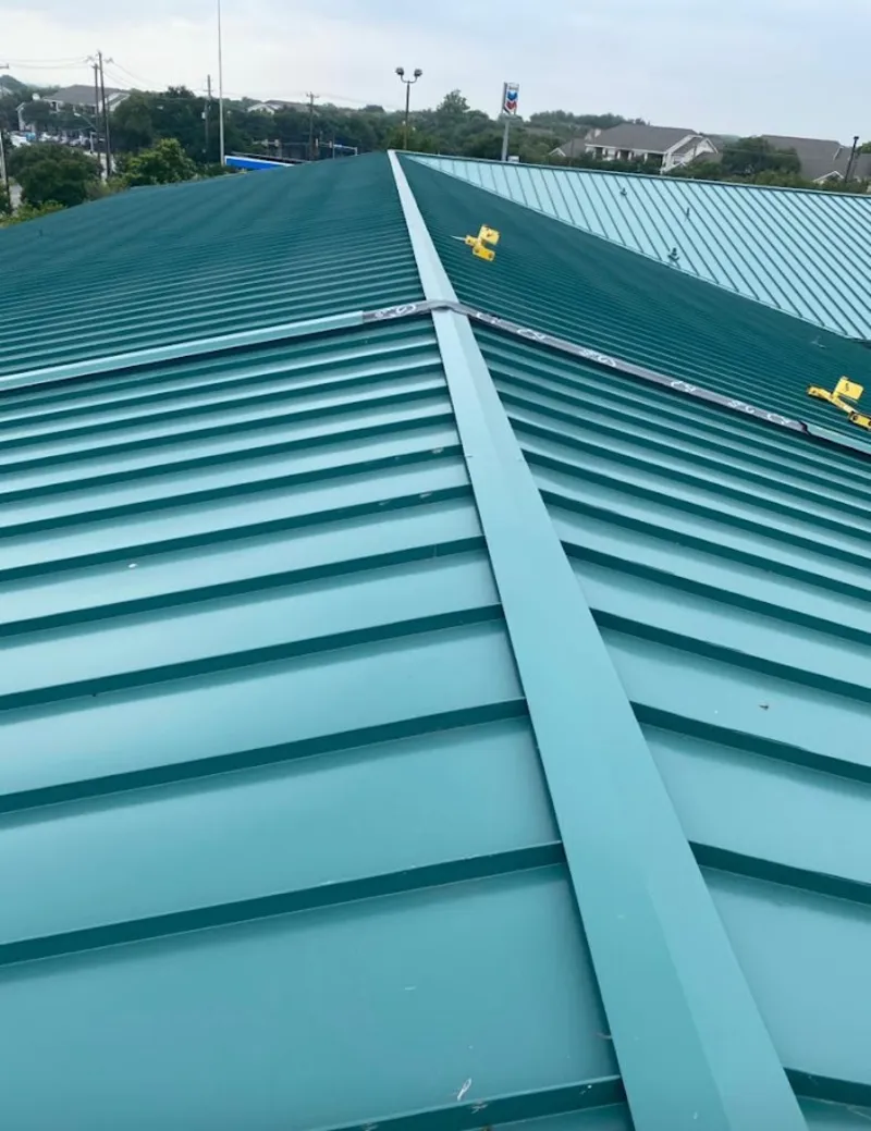 Green commercial metal roof ridge and valley for Metal Roof Repair in Mounds View